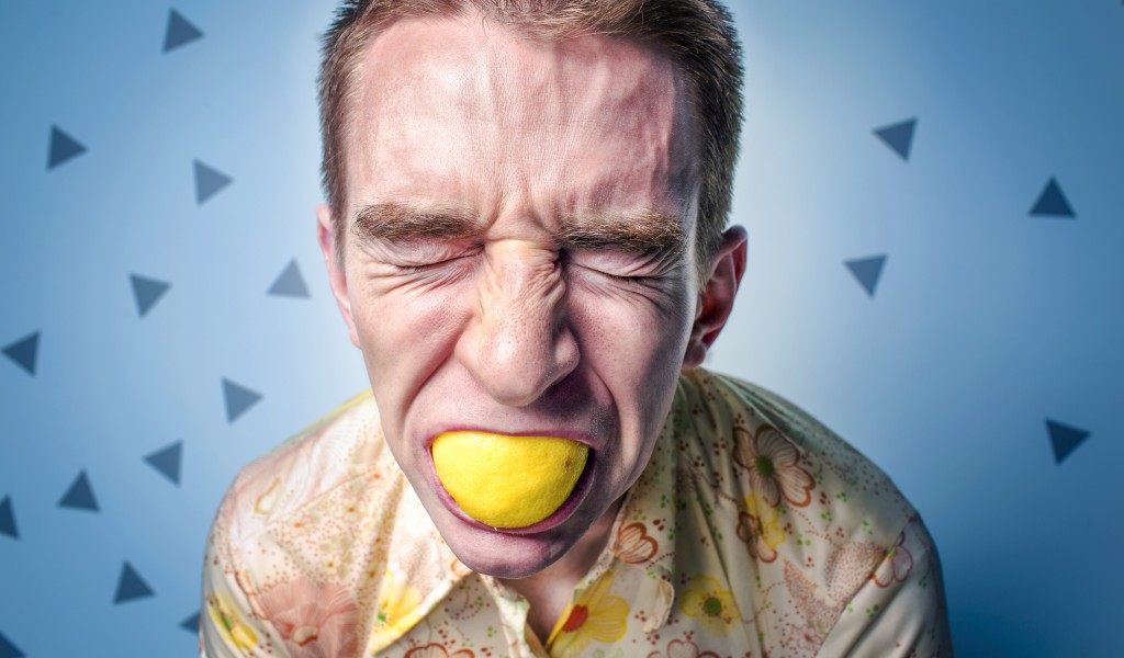 Man Eating Lemon